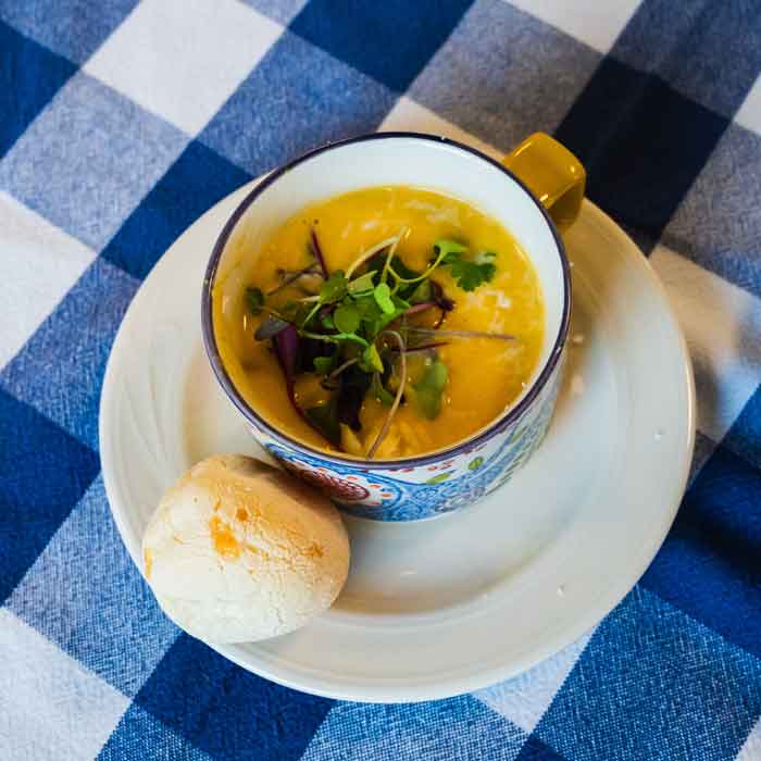 Cup of soup and roll made in Brazilian cooking class at BARN
