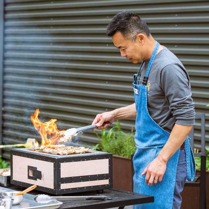 Wayne Chang grills yakitori in the kitchen garden