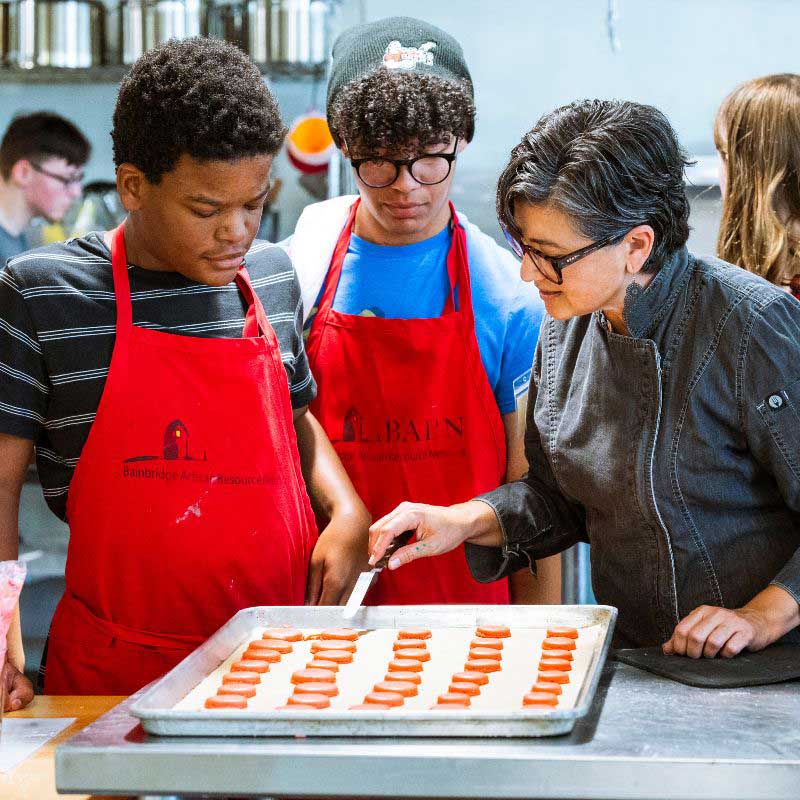 students in Mad Hatter Tea Party make macarons