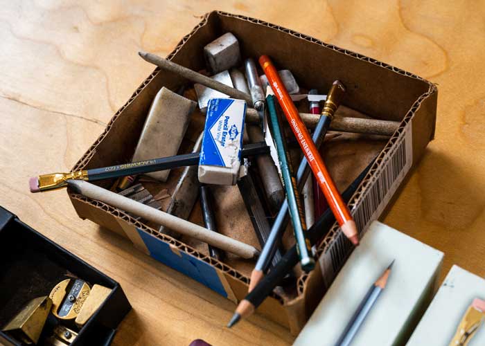 Box of pens and pencils on a table at BARN