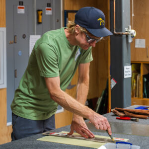 Sandberg working at the cutting table in his most recent class at BARN.