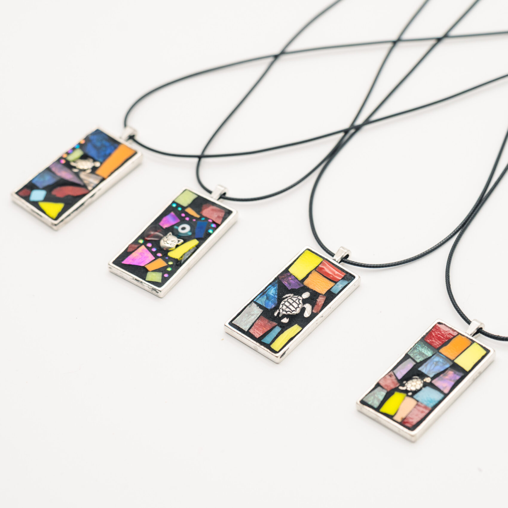 Mosaic pendants made at Refract 2025