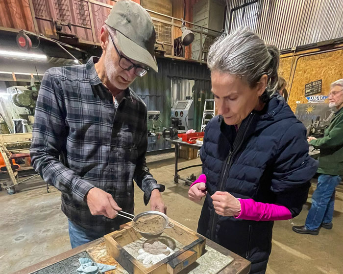 Frank Wurden with a student in the foundry