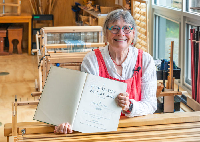 Caroline Cooley Browne with her inscribed copy of her grandmother Marguerite Porter Davison's book.