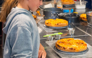 A child looking at a delicious cake